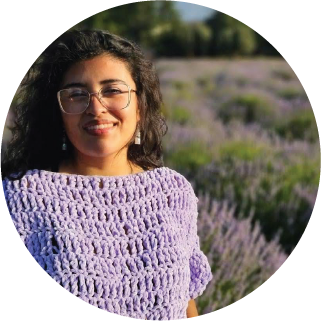 Picture of Sofia in front of a field of flowers